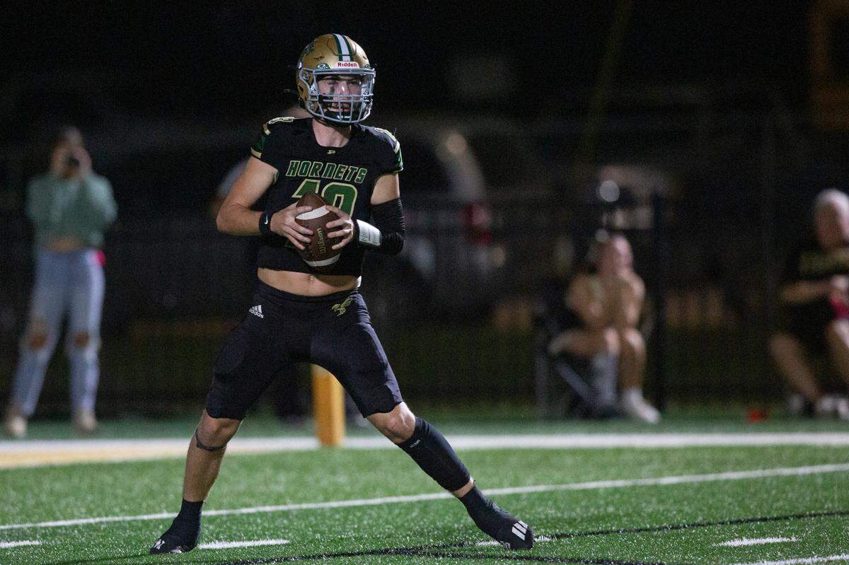 Poplarville’s Sydney Blackmon looks to throw a pass during a playoff game between Poplarville and Mendenhall at Poplarville on Friday, Nov. 8, 2024.