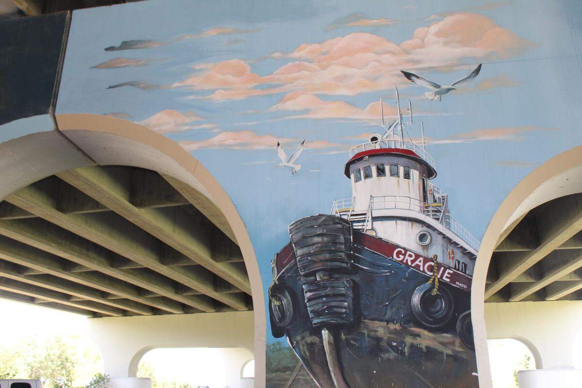 In his most recent mural, James Mayo paid tribute to his granddaughter, Gracie. The self-taught artist also tucked several ‘Easter eggs’ into the design — including a UFO.