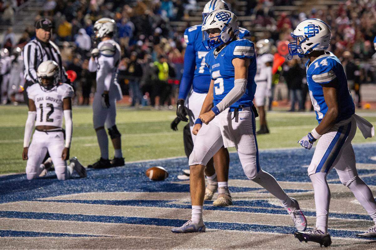 Ocean Springs’ quarterback Bray Hubbard celebrates after scoring a touchdown against Oak Grove during a 6A playoff game at Greyhound Stadium in Ocean Springs on Friday, Nov. 18, 2022.