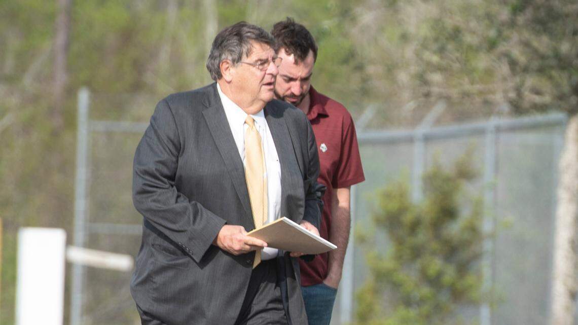 Alan Moran and his attorney, Donald Rafferty, walk into the Hancock County Jail in Bay St. Louis on Friday, March 3, 2023 as Moran surrenders himself following an indictment on felony charges for allegedly assaulting molesting a child and buying him beer.