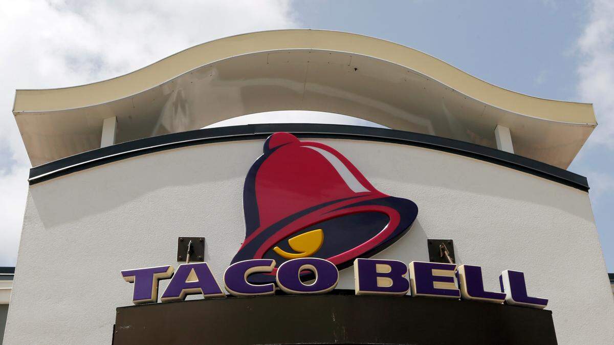 This photo taken Thursday, Aug. 3, 2017, a Taco Bell sign is shown at a restaurant in Hialeah, Fla.