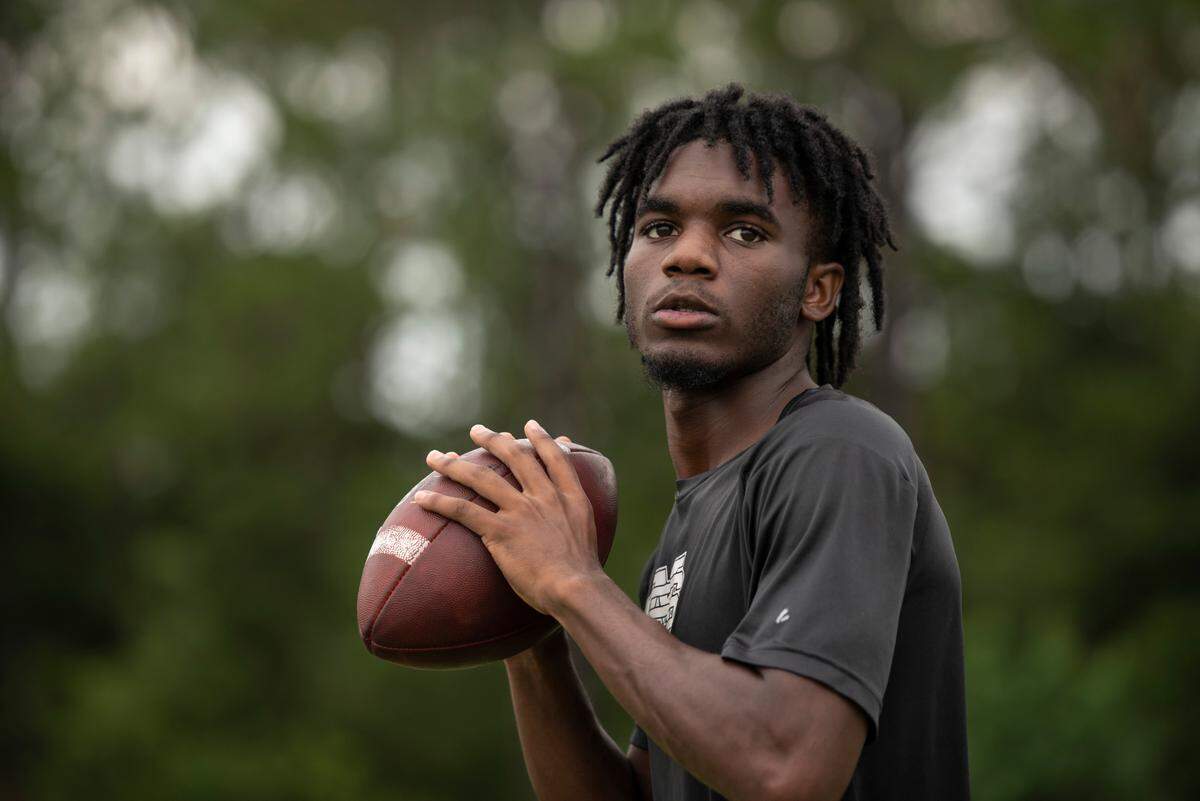 St. Martin’s quarterback, DK Jenkins, who is entering his senior year at St. Martin High School poses for a portrait at Joe Barlow Stadium in St. Martin on Wednesday, July 13, 2022.