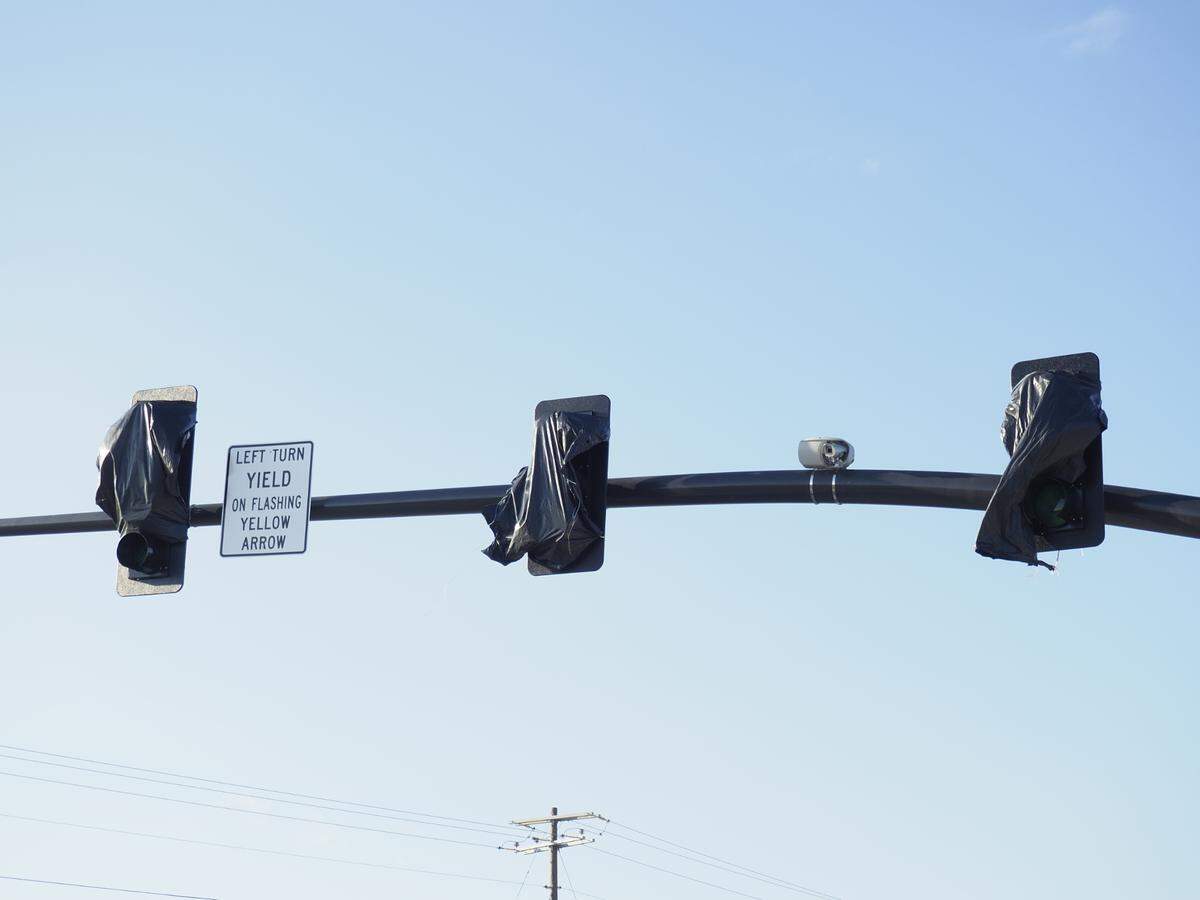 Traffic lights are in place and ready to be uncovered and operational once work is completed on the Menge Avenue overpass near the new Buc-ee’s in Harrison County, west of Gulfport.