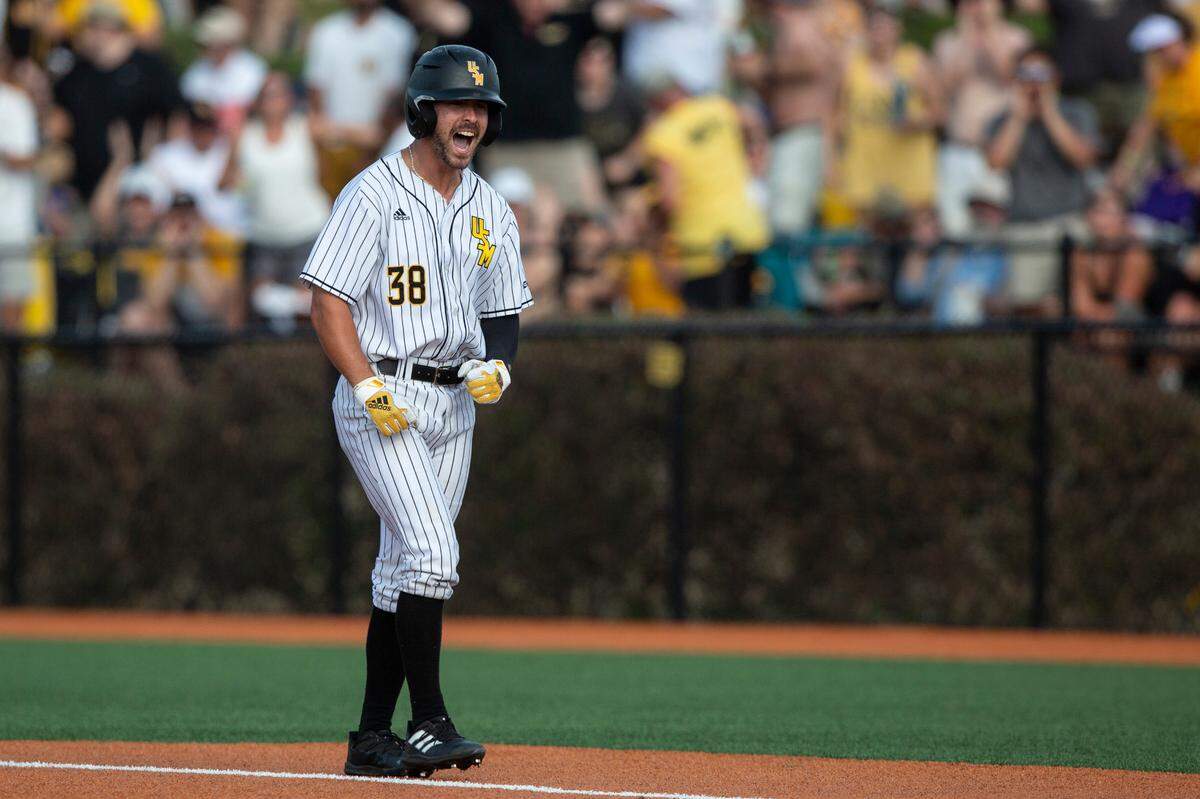 Southern Miss’s Reece Ewing cheers after reaching base during the NCAA Regional at Pete Taylor Park in Hattiesburg on Monday, June 6, 2022.