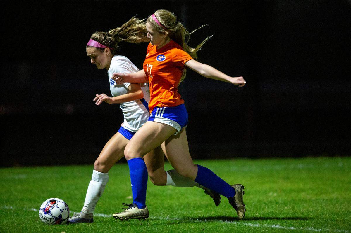 Gulfport’s Marissa Wingerter and Ocean Springs’ Ashton Rainey go for the ball during the 6A South State Championship game in Gulfport on Tuesday, Jan. 31, 2023.