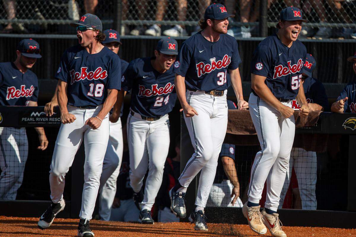 Ole Miss celebrates as TJ McCants scores a home run during the 8th inning of the Super Regionals finals at Pete Taylor Park on Sunday, June 12, 2022.