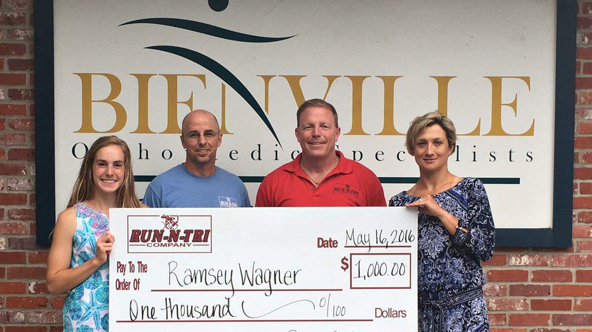 BIENVILLE ORTHOPAEDIC PHOTO 
 Bienville Orthopaedic Specialists presents a $1,000 scholarship to Ramsey Wagner. left. To her right are Luke Davidson and Dean Morrow, Run-N-Tri owners, and Yekaterina Karpitskaya, MD, physician at Bienville Orthopaedic.