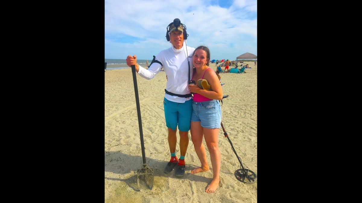 Local treasure hunter Brian Harper (left) and his metal detector are credited with locating a woman’s lost engagement ring on a beach in Tybee Island, Georgia.