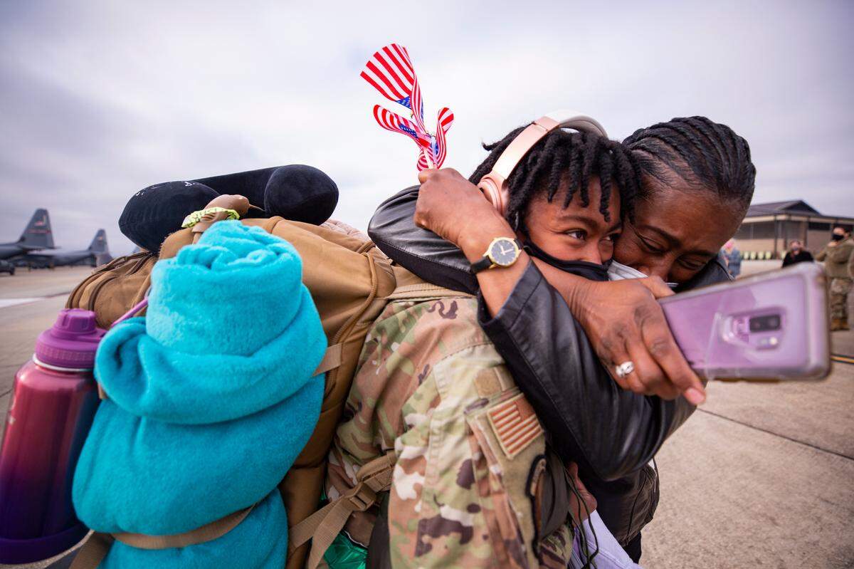 Cathy Beulah (right) hugs her daughter Darykah Henderson Saturday, Feb. 13, 2021 after a five-month deployment to Southwest Asia as part of the Air Force Reserve’s 403rd Wing to support Operations Freedom’s Sentinel and Inherent Resolve. The senior airman is part of material management for Keesler Air Force Base.