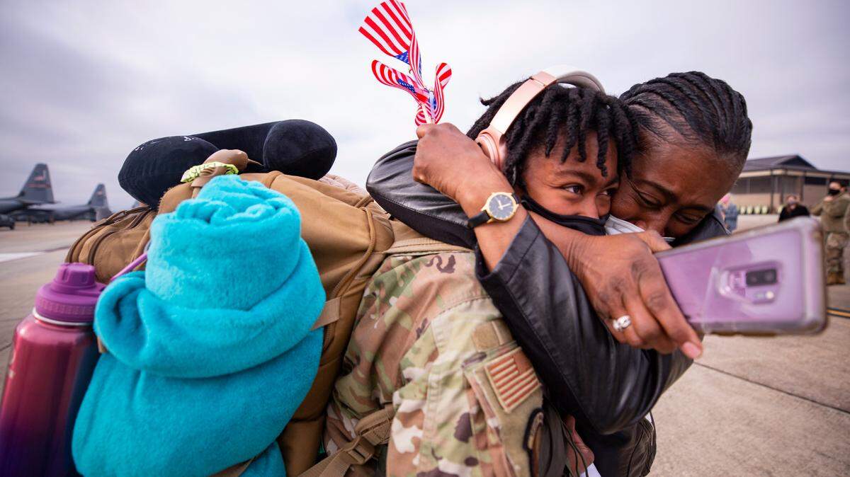 Cathy Beulah (right) hugs her daughter Darykah Henderson Saturday, Feb. 13, 2021 after a five-month deployment to Southwest Asia as part of the Air Force Reserve’s 403rd Wing to support Operations Freedom’s Sentinel and Inherent Resolve. The senior airman is part of material management for Keesler Air Force Base.