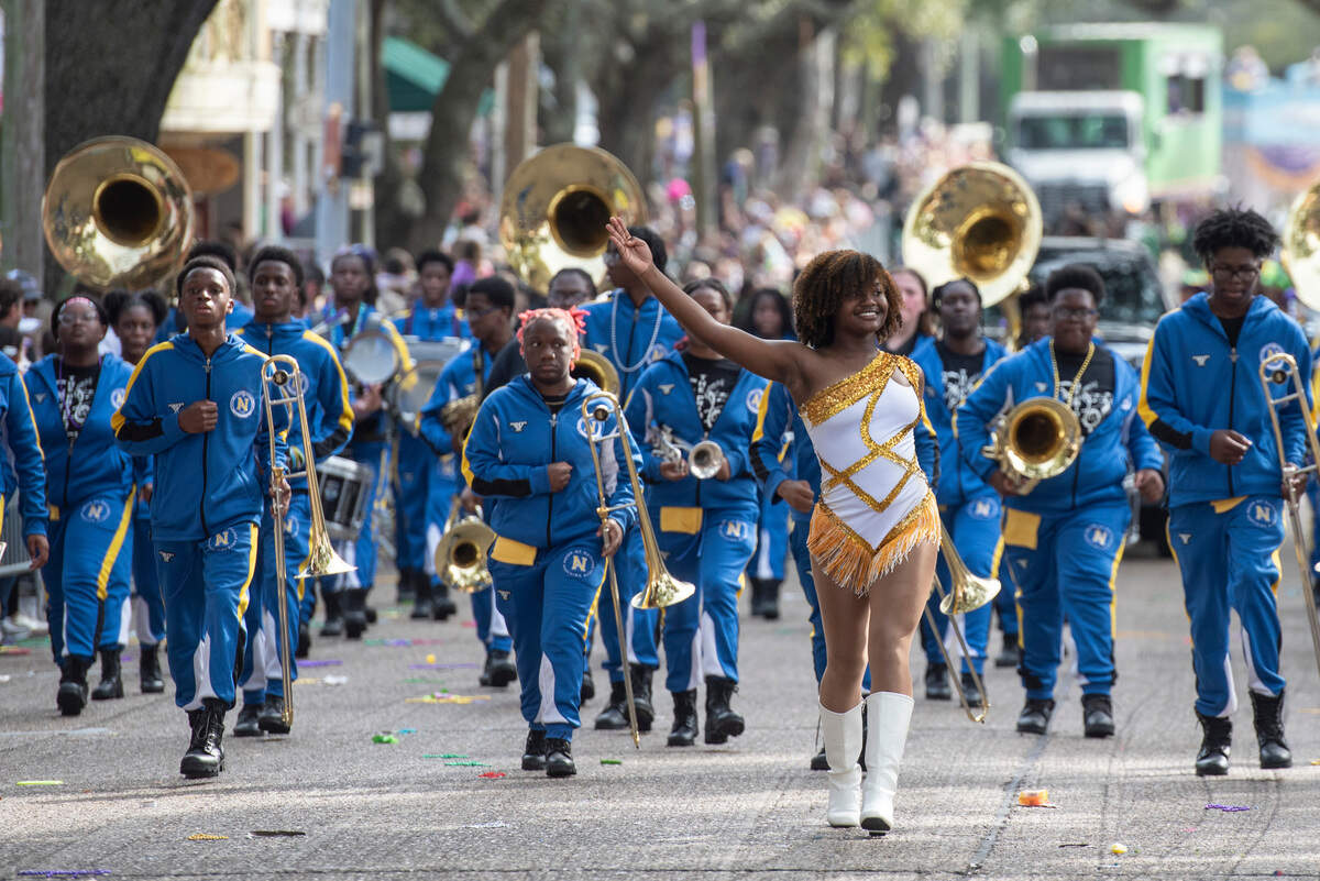The Natchez High School marching band marches during the Ocean Springs Elks Club Mardi Gras Parade in Ocean Springs on Saturday, Feb. 15, 2025.