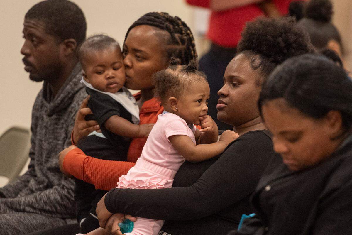 Expecting families and new mothers listen to speakers during a community baby shower event at Lyman Community Center in Gulfport on Thursday, Nov. 14, 2024.