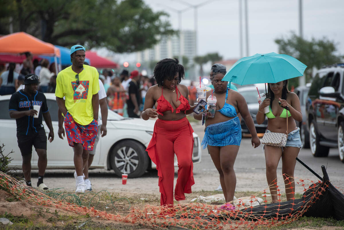 Spring breakers walk down Highway 90 next to Biloxi Beach during Black Spring Break on Saturday, April 15, 2023. Most of the events are moving out of Biloxi this year, the organizers posted Monday.