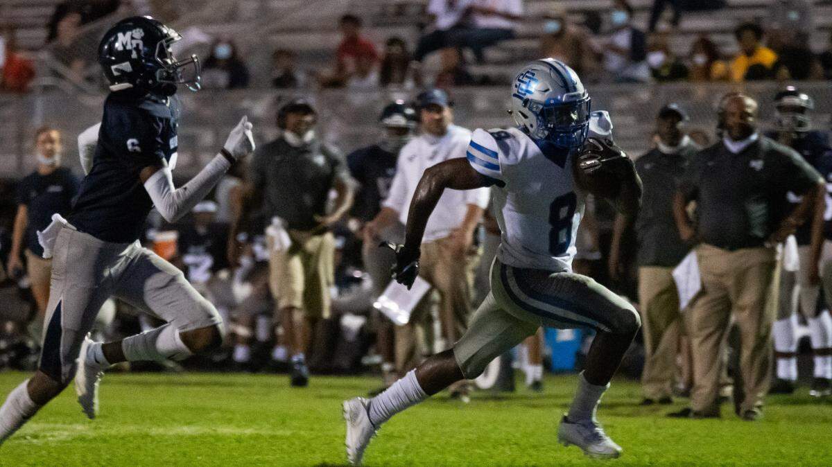 Ocean Springs halfback David Humphries rushes for a touchdown in the Greyhounds’ 26-15 victory over Moss Point on Friday, Sept.4, 2020