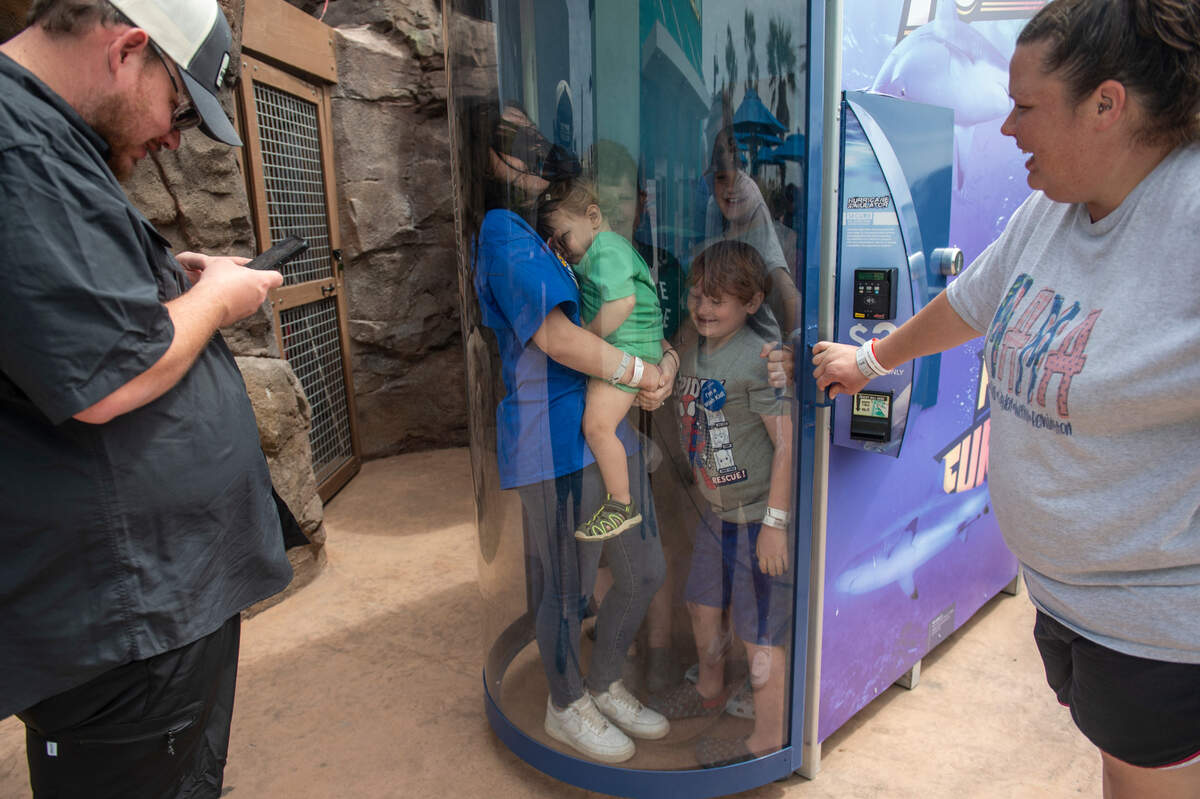 Weston Brown, 6, center right, and his siblings stand in a hurricane simulator at the Mississippi Aquarium in Gulfport on Wednesday, March 20, 2024. Weston, who is in remission from cancer, chose to come to the Mississippi Coast for a trip provided by Make-A-Wish.