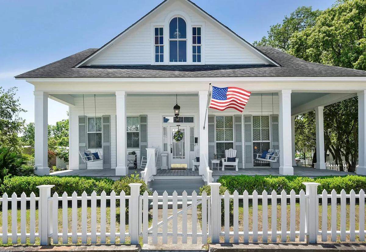 Crane Builders won the award for historical preservation residential with this home complete with a white picket fence.