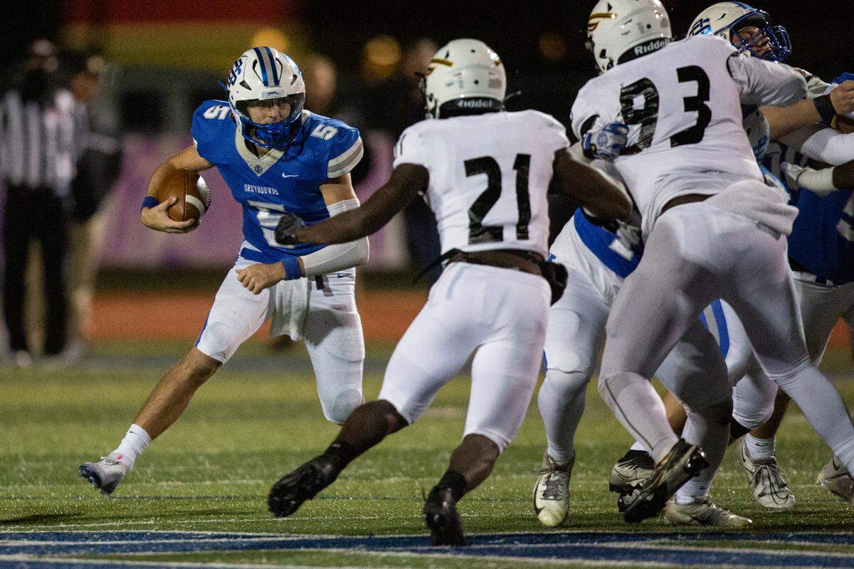 Ocean Springs’ quarterback Bray Hubbard runs the ball during a 6A playoff game at Greyhound Stadium in Ocean Springs on Friday, Nov. 18, 2022.