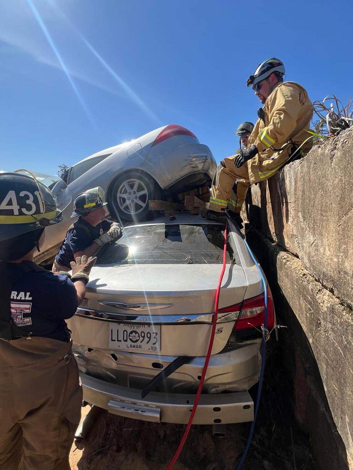 Volunteer firefighters participate in a vehicle extrication training exercise in Lamar County, Miss. Departments across the state rely on regular drills to stay prepared — even when working with aging or limited equipment.