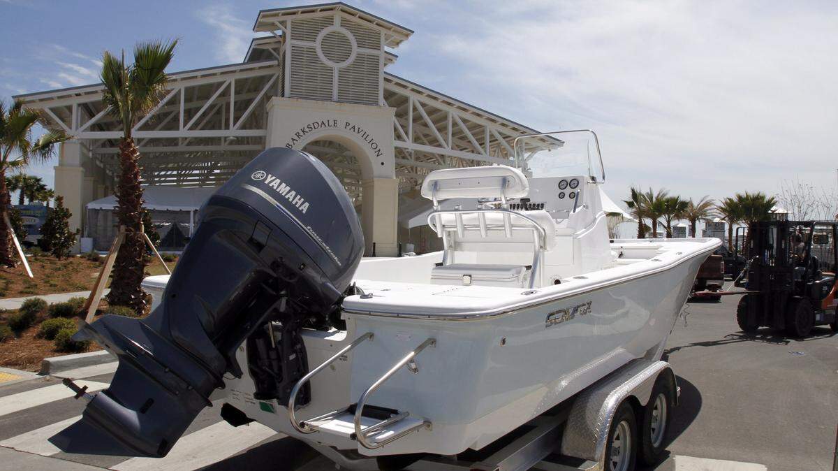 TIM ISBELL/SUN HERALD 2013 
 A boat is carefully backed into position with other parked boats. The GulfCoast Yacht and Boat show will be held next weekend at the Gulfport Harbor.