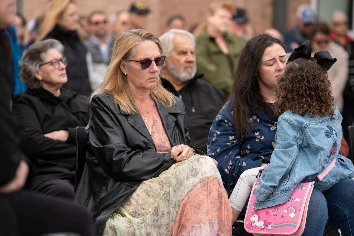 Members of Steven Robin’s family during a ceremony dedicating commemorative stars in honor of Sergeant Steven Robin and Officer Branden Estorffe outside the new Bay St. Louis Police Department in Bay St. Louis on Thursday, Dec. 14, 2023.