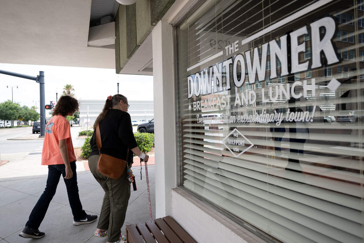 People walk into The Downtowner during its opening day in Gulfport on Tuesday, June 9, 2026.