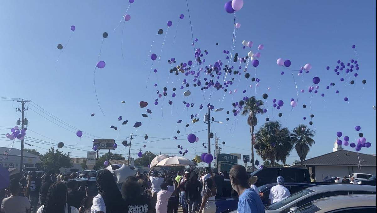 Family and loved ones released purple balloons into the sky Friday evening at the corner of Old Mobile Highway and Market Street in Pascagoula. The gathering honored Jackie Davis, who was killed after a truck hit him near the intersection on Wednesday.