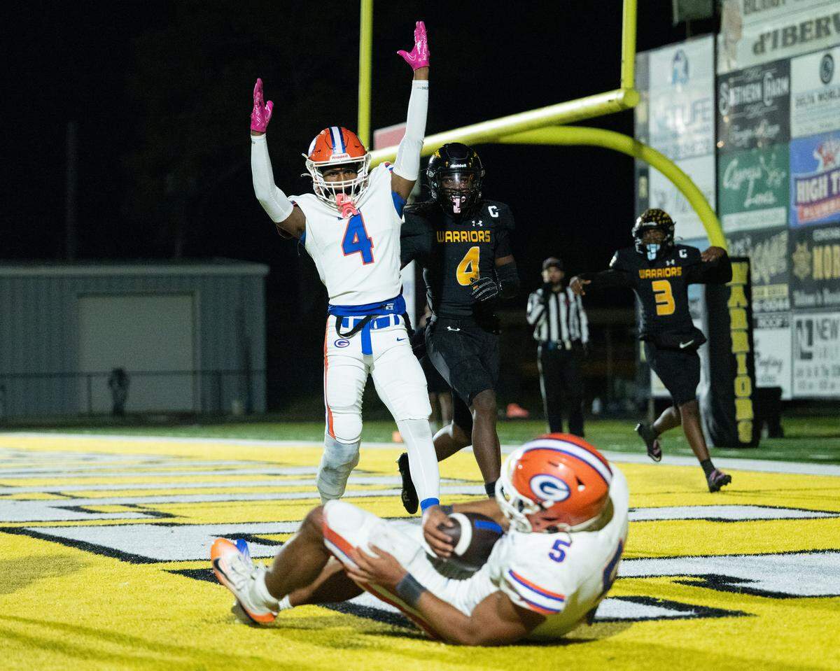 Gulfport wide receiver Javious Hales (4) celebrates a touchdown scored by running back Cooper Crosby (5) against D’Iberville.