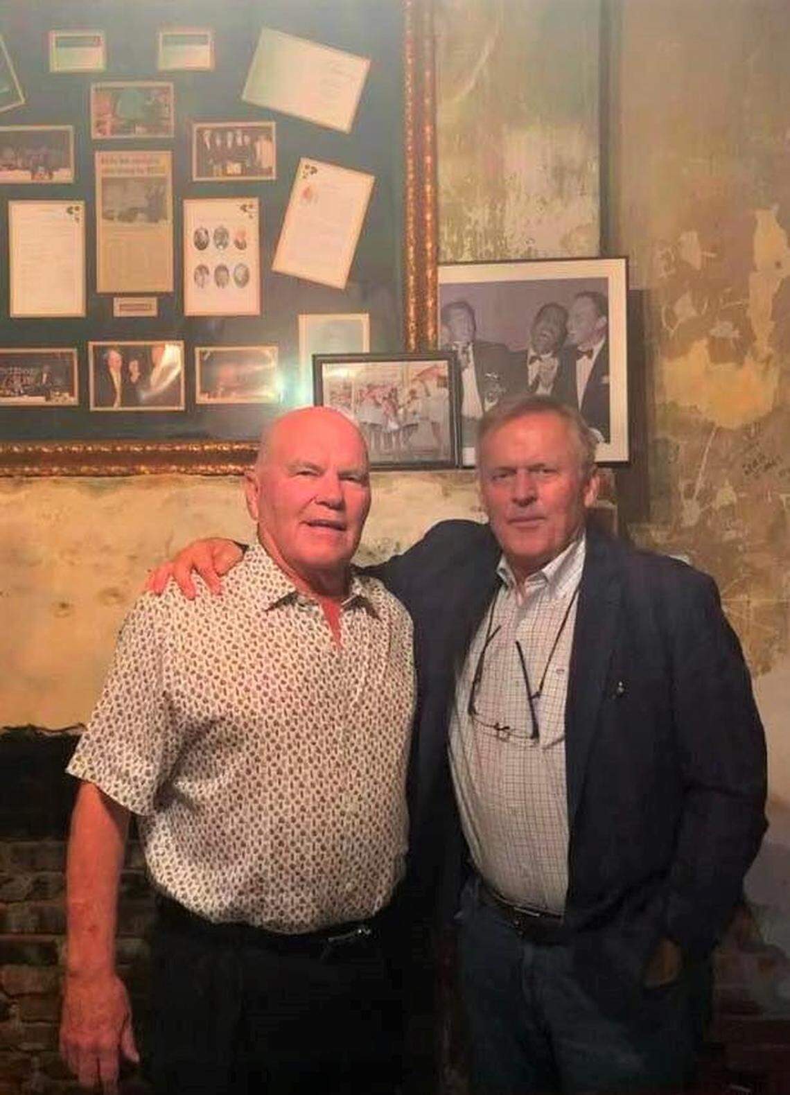 Best-selling author John Grisham, right, gets a new picture with his friend Bobby Mahoney, owner of Mahoney’s Old French House in Biloxi, where Grisham’s latest novel is set.