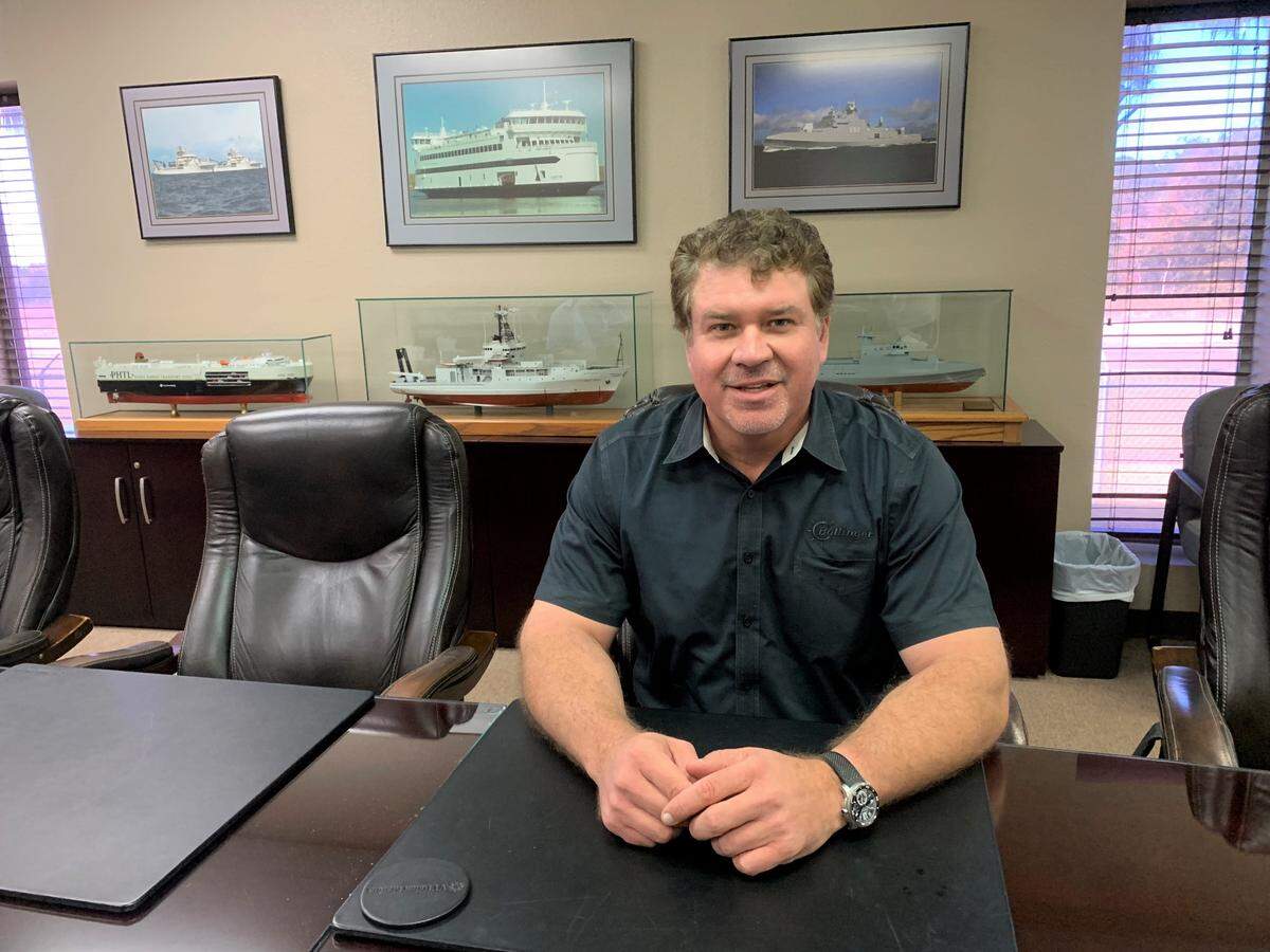 Bollinger Shipyards CEO Ben Bordelon sits in the boardroom at VT Halter Marine in Pascagoula. Bollinger, the largest privately-owned and operated shipbuilder in the U.S., is buying VT Halter.