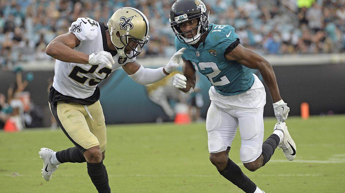 New Orleans Saints cornerback Marshon Lattimore, left, defends Jacksonville Jaguars wide receiver Dede Westbrook (12) as he runs a pass pattern during the first half of an NFL preseason football game, Thursday, Aug. 9, 2018, in Jacksonville, Fla.