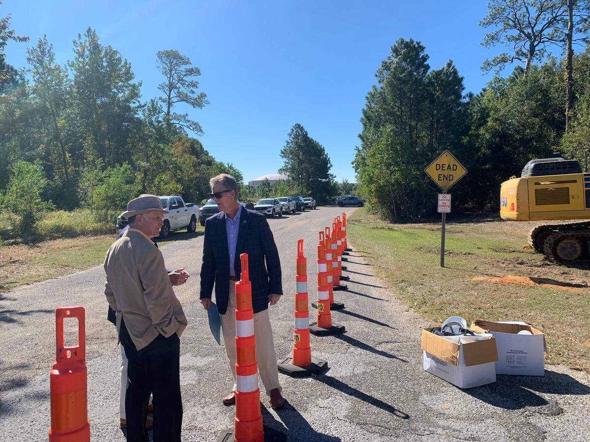 Biloxi Mayor Andrew “FoFo” Gilich (right) and Councilman Rodney McGilvary stand in the area that will become the Popp’s Ferry Extension, set to open by the end of 2026. Groundbreaking for the new road and the opening of the new Rouses Market was a double celebration in Biloxi Wednesday, Oct. 16, 2024.
