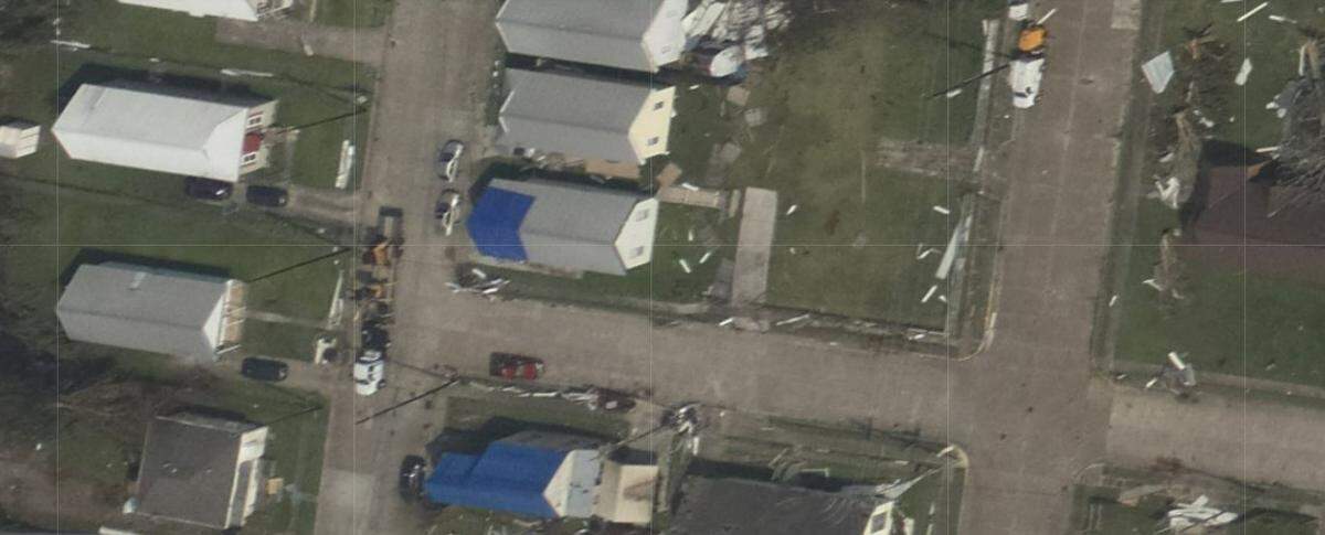 This area of Houma, just west of the Intracoastal Waterway, shows the damage and blue tarps covering roofs after Hurricane Ida on Aug. 29, 2001.
