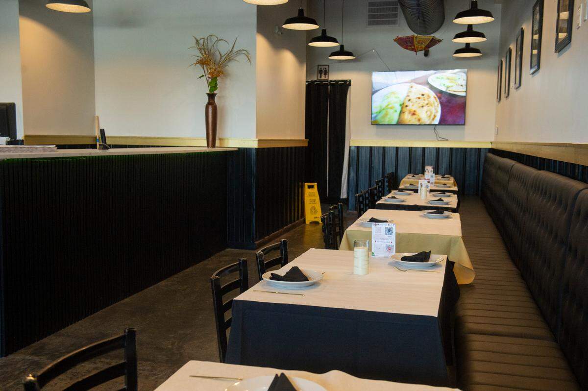 Tables are set for lunch as Indian Delight restaurant opens on Washington Avenue in Ocean Springs.