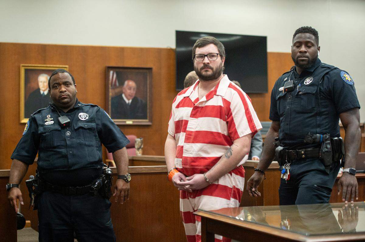 John Ross McElhenney is led out of the court room after being sentenced to life in prison after he plead guilty to sexual battery and child exploitation in Harrison County Circuit Court in Biloxi on Tuesday, Aug. 1, 2023.