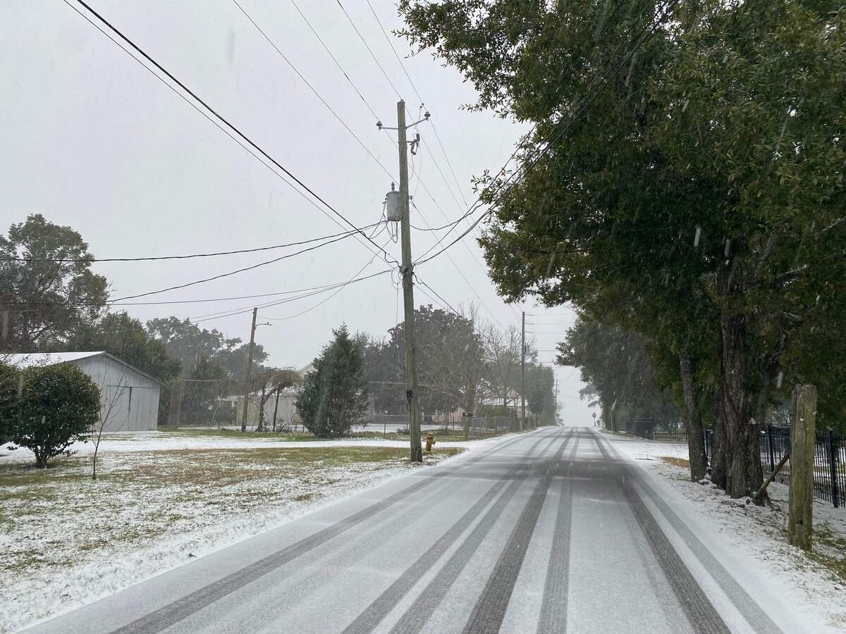 Snow started falling in Pass Christian around dawn on Tuesday, Jan. 21, 2025. The National Weather Service predicted the Mississippi Coast could get up to 4 inches of snow in the historic winter storm.
