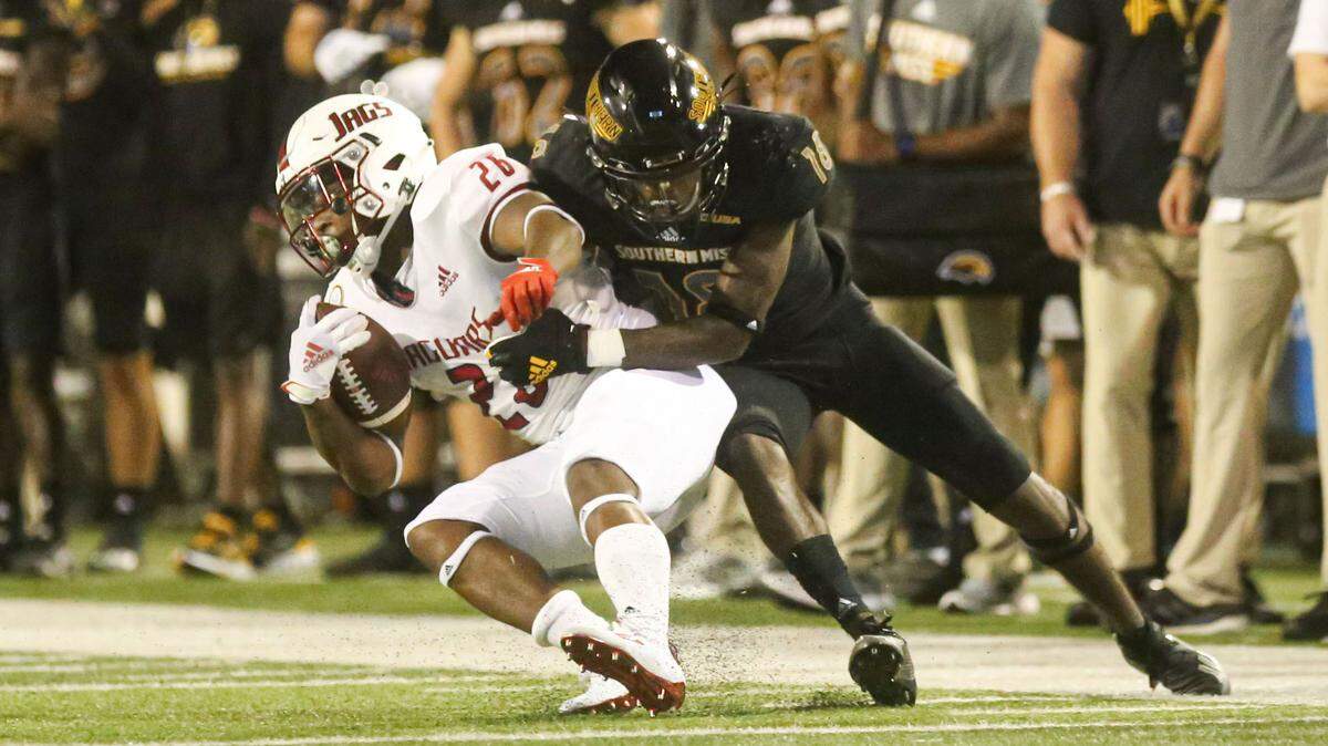 Southern Miss’ Natrone Brooks tackles a South Alabama receiver in the Golden Eagles’ home opener against the Jaguars. South Alabama beat out Southern Miss 32-21 September 3, 2020.