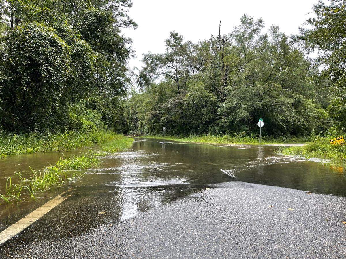 The waterfront neighborhood on River Road off of Three Rivers Road in Biloxi is already seen flood waters from the rising Biloxi River on Thursday. The river is expected to crest at 14.5 feet on Friday morning. The flood height for the Biloxi River is 12 feet.