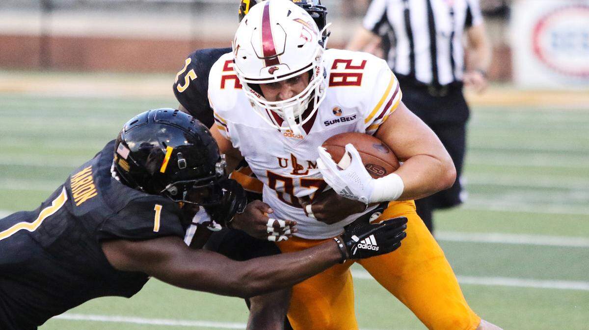 Louisiana-Monroe tight end Sloan Spiller (82) works for extra yardage as Xavier Marion (1) and Tyler Barnes (25) try to bring him down Saturday in Hattiesburg.
