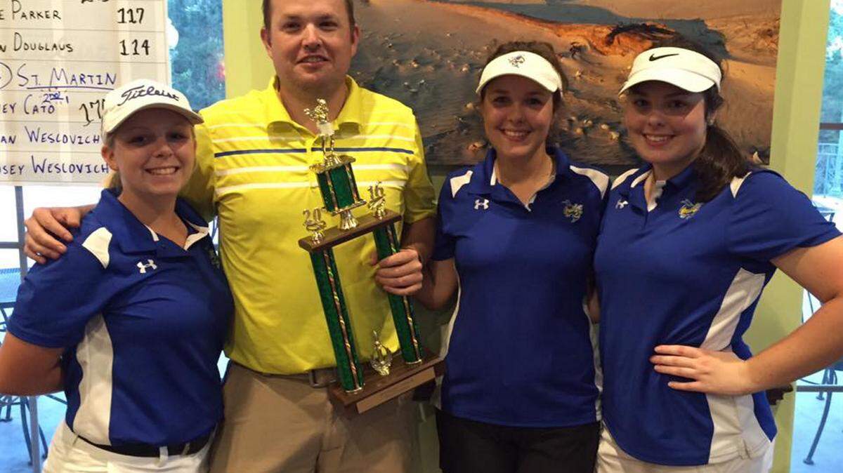 SUBMITTED 
 St. Martin's girls golf team won the Class 3, Region 7, District 8 championship Thursday at Shell Landing in Gautier. Members of the team are Sydney Cato, Jordan Wescovich, Lyndsey Wescovich and coach Brandon Laird.