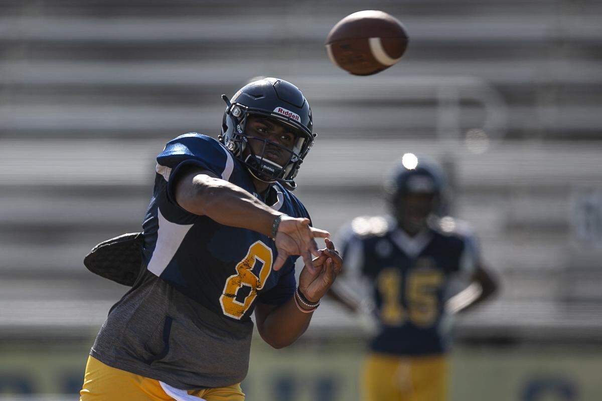 Gautier High School quarterback Kaden Irving throws a pass during practice on Thursday, Sept. 9, 2021.