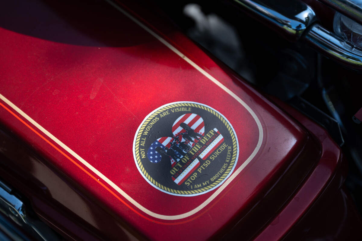 A motorcycle features a sticker representing LOC 22, an organization that works toward military suicide awareness and prevention, during a ceremony at Biloxi National Cemetery on Saturday, July 11, 2026.