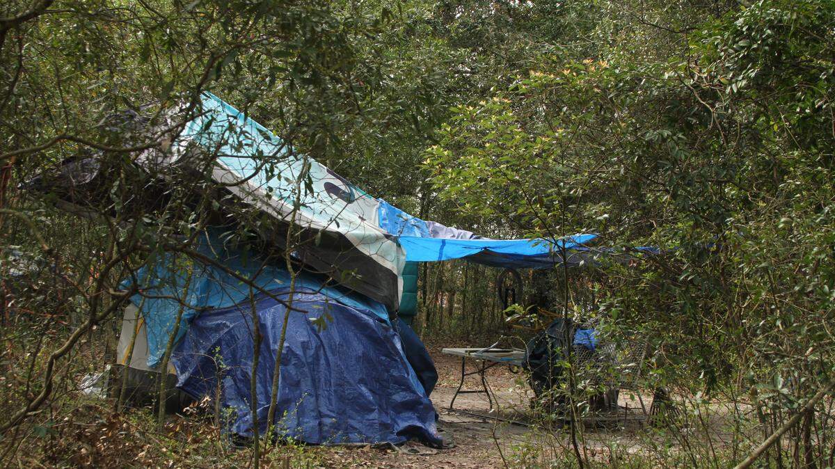 This file photo from 2019 shows a tent at one of numerous camps scattered through the woods beside the Kansas City Southern rail line that runs north-south through Gulfport. A new Homeless Resource Center will offer day shelter and services in Gulfport, which provided a federal CARES Act grant of more than $1 million for the project.