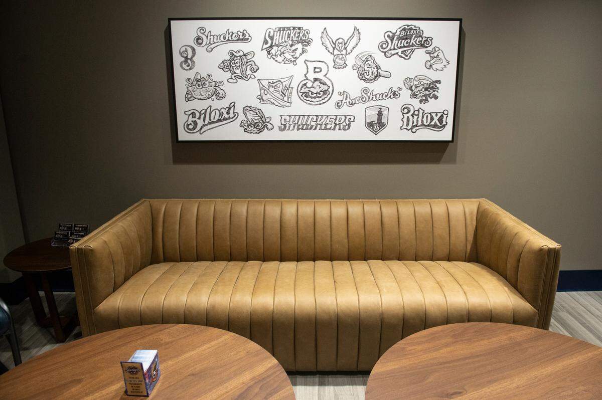 Art from the original logo design process for the Biloxi Shuckers on display in the recently renovated Sparklight Lounge at Shuckers Ballpark, on Friday, May 10, 2024. The lounge is included with tickets in the first few rows behind home plate and includes food.