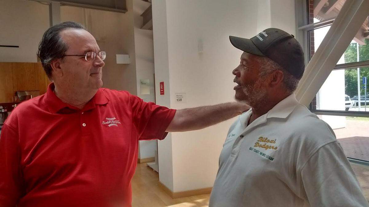 VETO ROLEY/SPECIAL TO THE SUN HERALD 
 Dick "Lefty" O'Neal (left), former pitcher for the Biloxi Dodgers, speaks with former battery mate Johnny Thompson on Friday at the Ohr Museum. O'Neal, who was stationed at Keesler Air Force Base, is the only white player to play for two Negro League teams.
