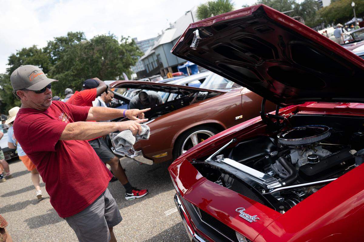 Blane Solar describes the custom work done on the engine of his 1967 Chevrolet Camero during the Biloxi Block Party.