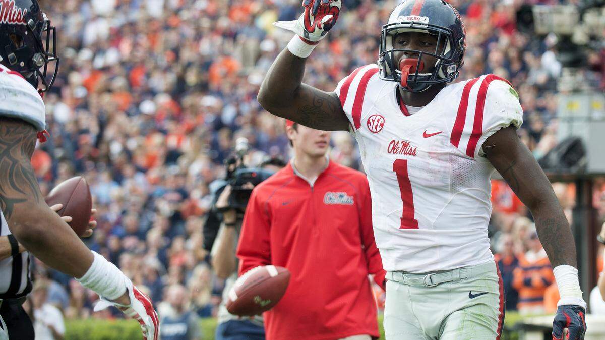 Mississippi wide receiver Laquon Treadwell celebrates after scoring a touchdown over Auburn defensive back Carlton Davis (18) during the fourth quarter of an NCAA college football game on Saturday, Oct. 31, 2015, in Auburn, Ala. (Albert Cesare/The Montgomery Advertiser via AP) NO SALES; MANDATORY CREDIT