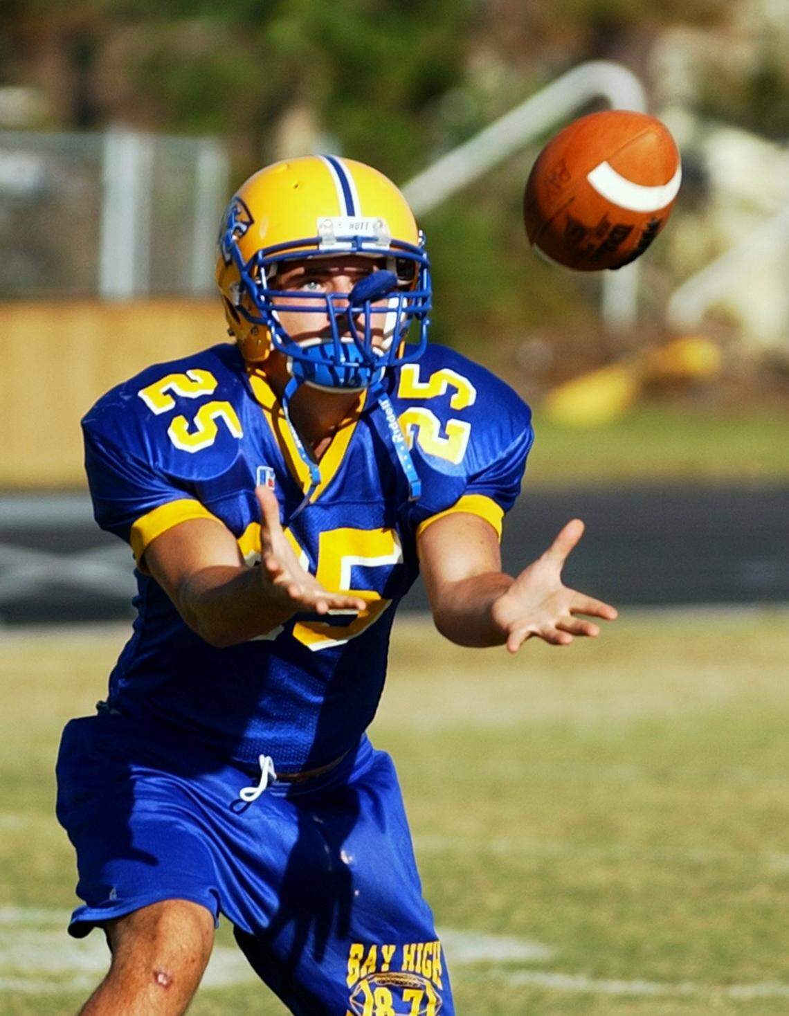 Bay High Kyle Moran keeps his eye on the ball as he catches a pass in practice on Tuesday, October 18, 2005.