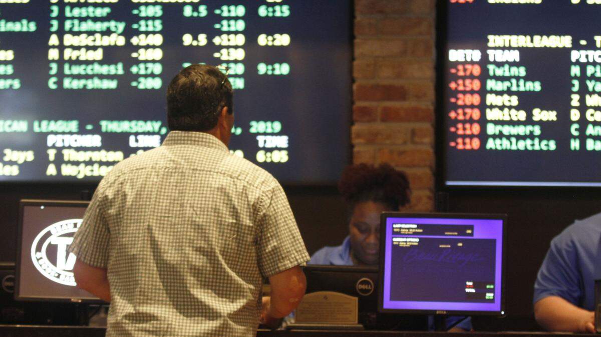 A man places a bet at the TAP Book, Bar & Bistreaux in the Beau Rivage Casino in Biloxi, Mississippi. Florida may soon have its own sports betting sites if the state completes an agreement in principle with the Seminole Tribe.