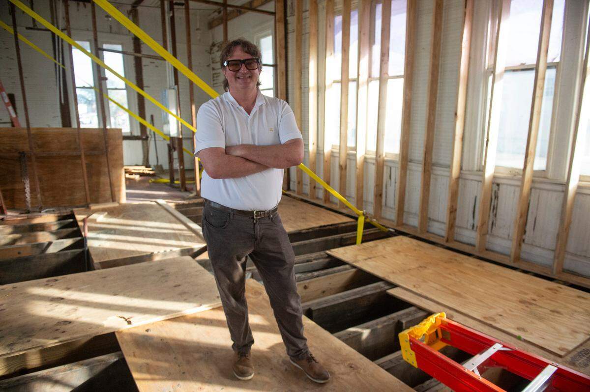 Joe Cloyd stands in the brewing room in January 2025, before the 1904 Pascagoula train station in Pascagoula was restored. The original floors were planed and relaid, and the building straightened on its way to becoming the new Chandeleur Depot Brewpub, opening soon,
