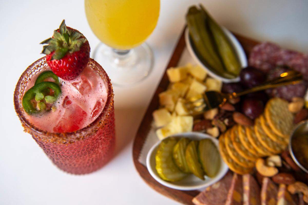 The Fire Bird Margarita, which contains tequila, jalapeño juice, strawberry puree, lime juice, citrus and tajin, at the Hen House in Bay St. Louis on Wednesday, May 29, 2024.
